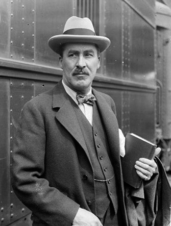 Howard Carter examining the innermost coffin of Tutankhamun after the 1922 discovery.