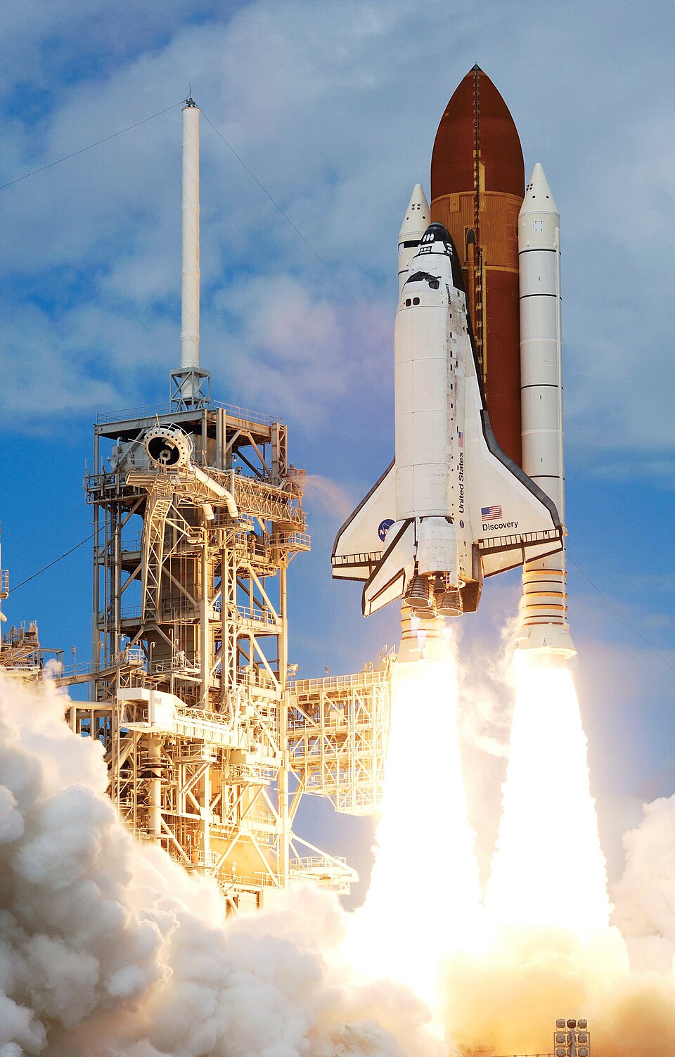 The Space Shuttle lifting off from the launch pad.