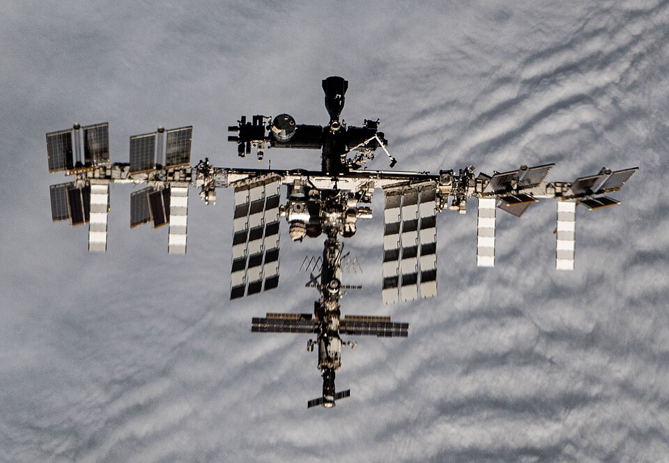 The International Space Station photographed against the blackness of space.
