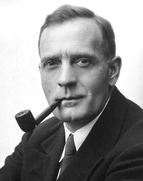 Edwin Hubble at the eyepiece of a large telescope on Mount Wilson.