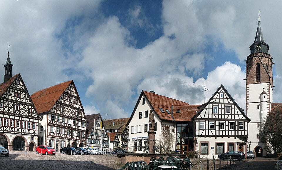 A traditional timber-framed building showing exposed jointed oak framing.