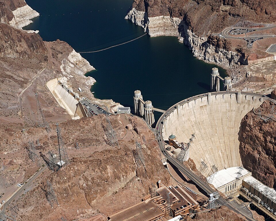 The concrete arch-gravity wall of Hoover Dam spanning the Black Canyon of the Colorado River.