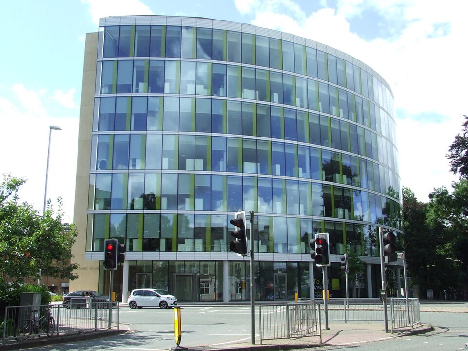 Glass-tower offices typical of a modern corporate law firm
