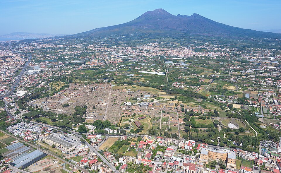 Ruined streets and buildings of Pompeii, whose walls preserved ancient painted advertisements.