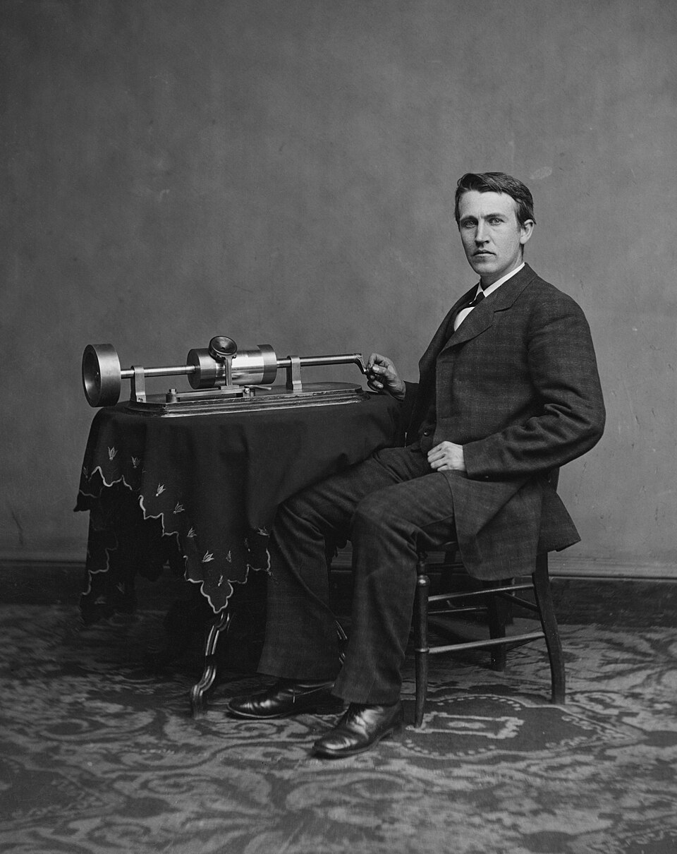An early Edison phonograph with its brass horn and wax cylinder