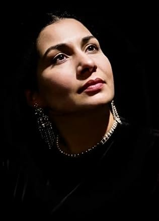 Photograph of Egyptian singer Umm Kulthum performing