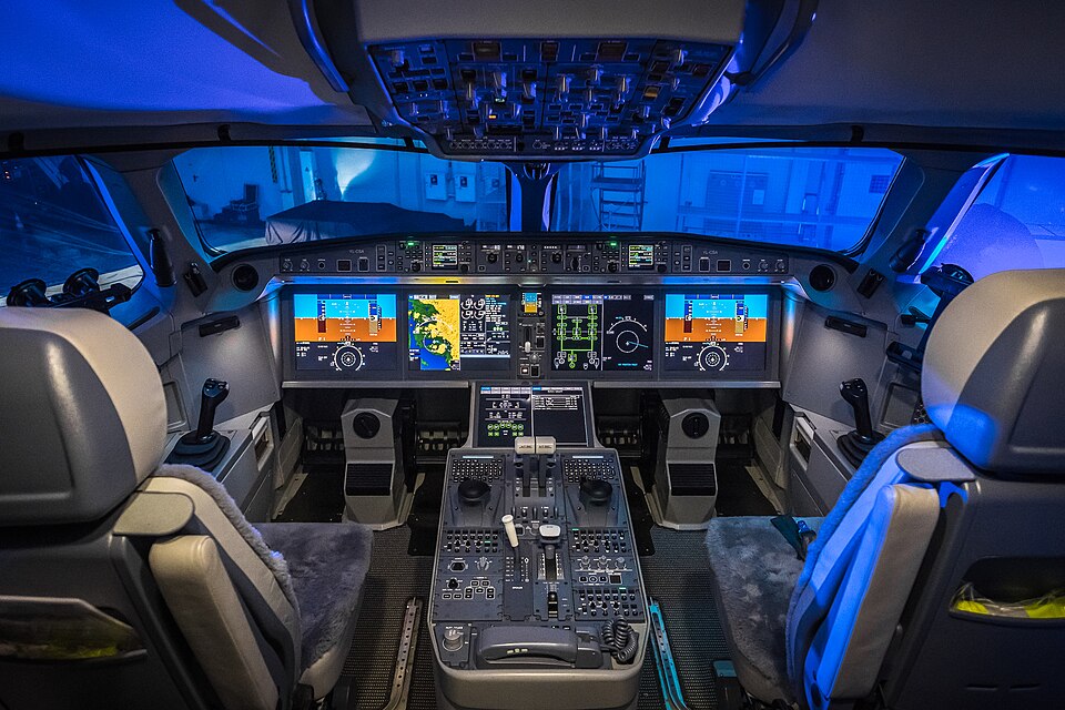 A modern glass cockpit with digital flight displays replacing analog instruments.